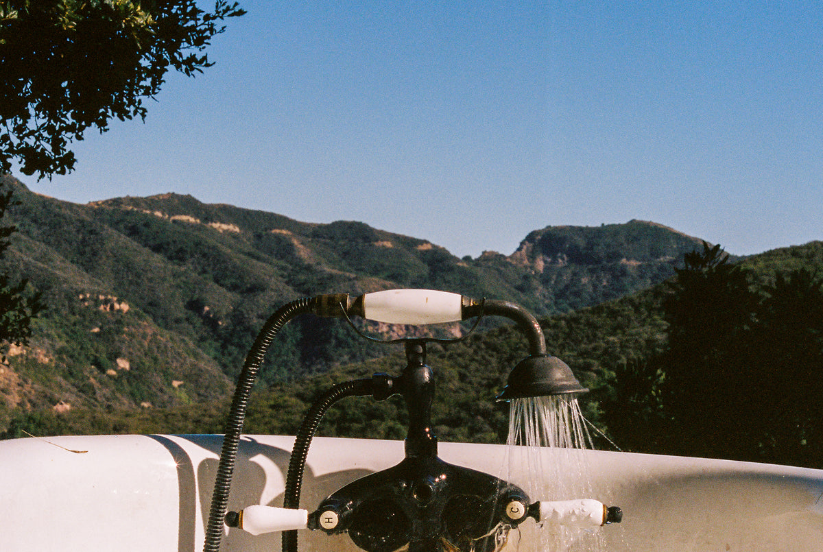 Outdoor shower with mountains in the background